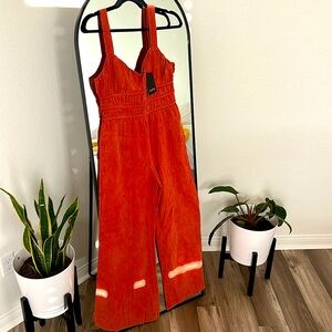Burnt orange jumpsuit. Brand is Fate size medium. Brand new never worn
